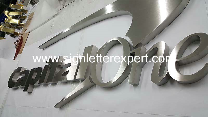 brushed stainless steel letter signs (2)